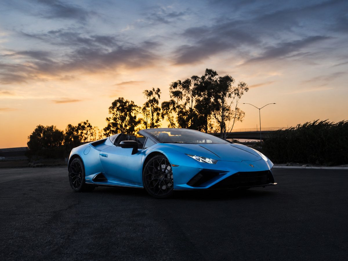 Blue Lamborghini Huracan at sunset